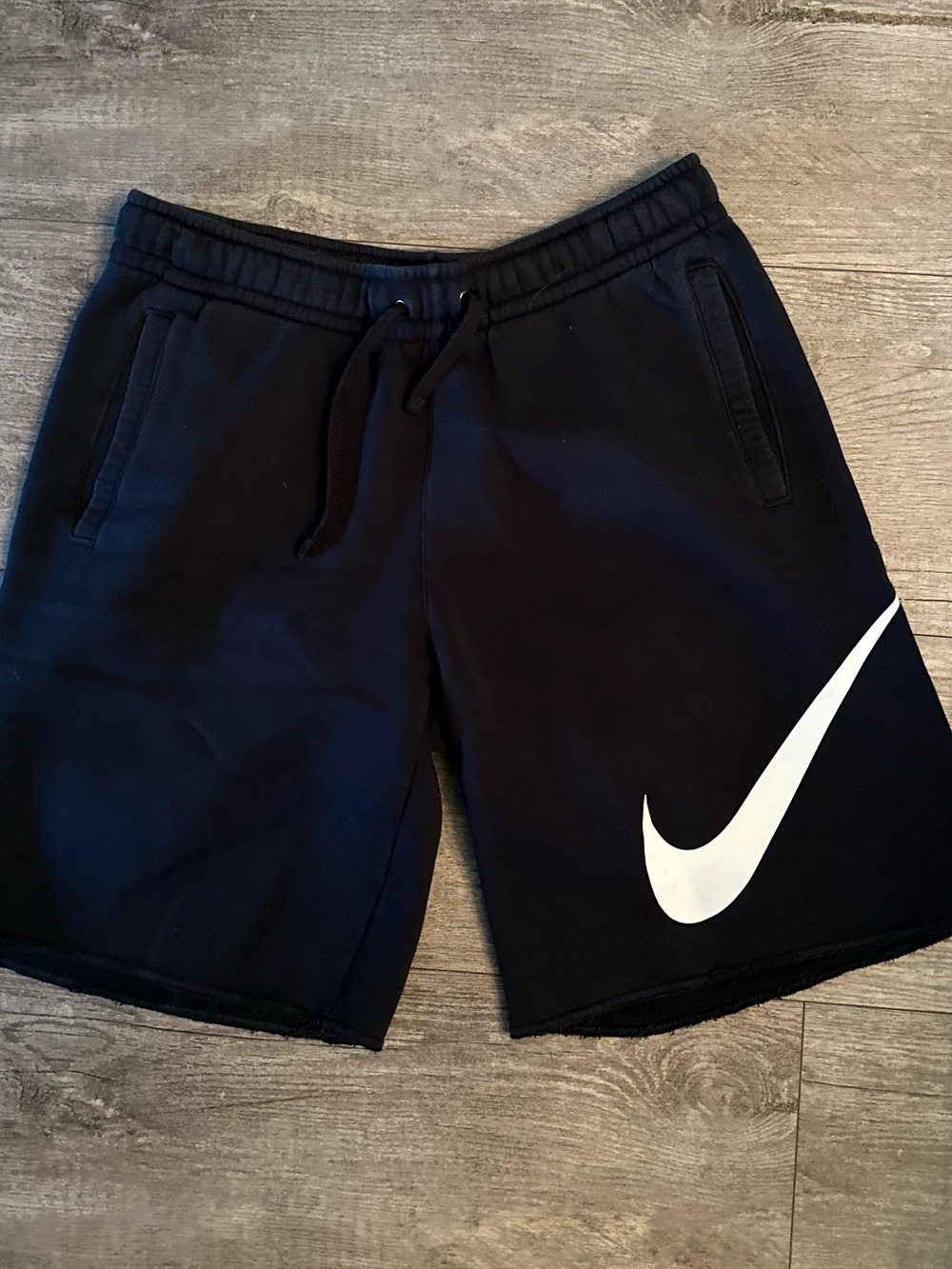 Nike Black Athletic Shorts with Large White Swoosh